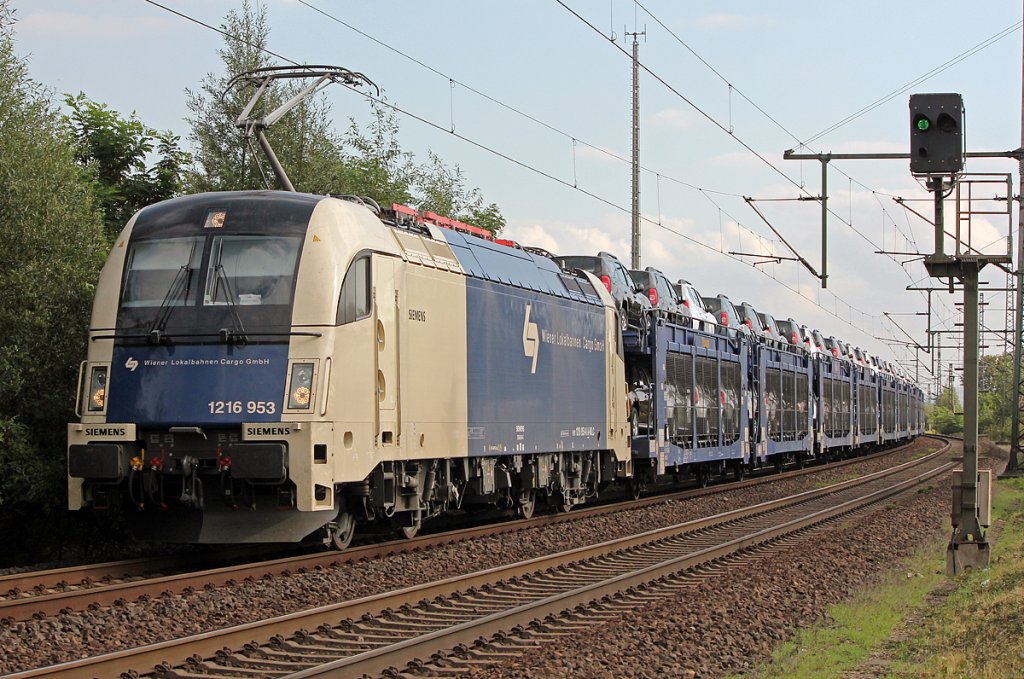 1216 953 der Wiener Lokalbahnen mit Dacia Autozug in Porz Wahn am 15.09.2011