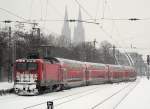 112 xxx-x mit dem RE7 nach M�nster im winterlichen K�ln Messe/Deutz am 24.12.2010