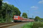 143 177-4 zieht die S6 nach K�ln-Nippes am 16.09.2012 durch einen kleinen Einschnitt zwischen Essen-Werden und Essen-Kettwig.