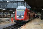 Der RE nach Kassel wartet am 11.05.2010 bei einsetzenden Gewitter im Frankfurter Hbf.